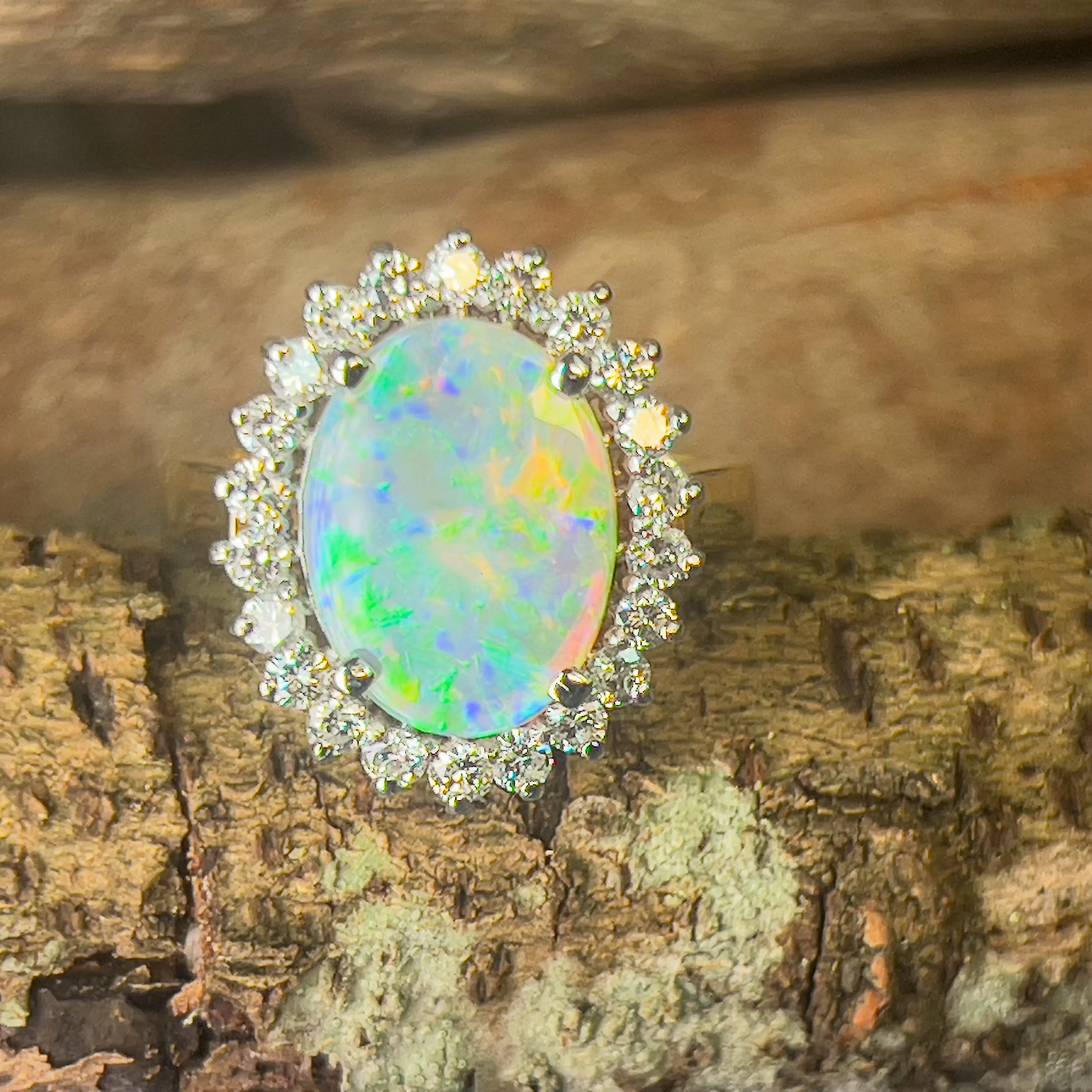 Platinum and 18kt Yellow Gold classic cluster ring with Black Opal and Diamonds