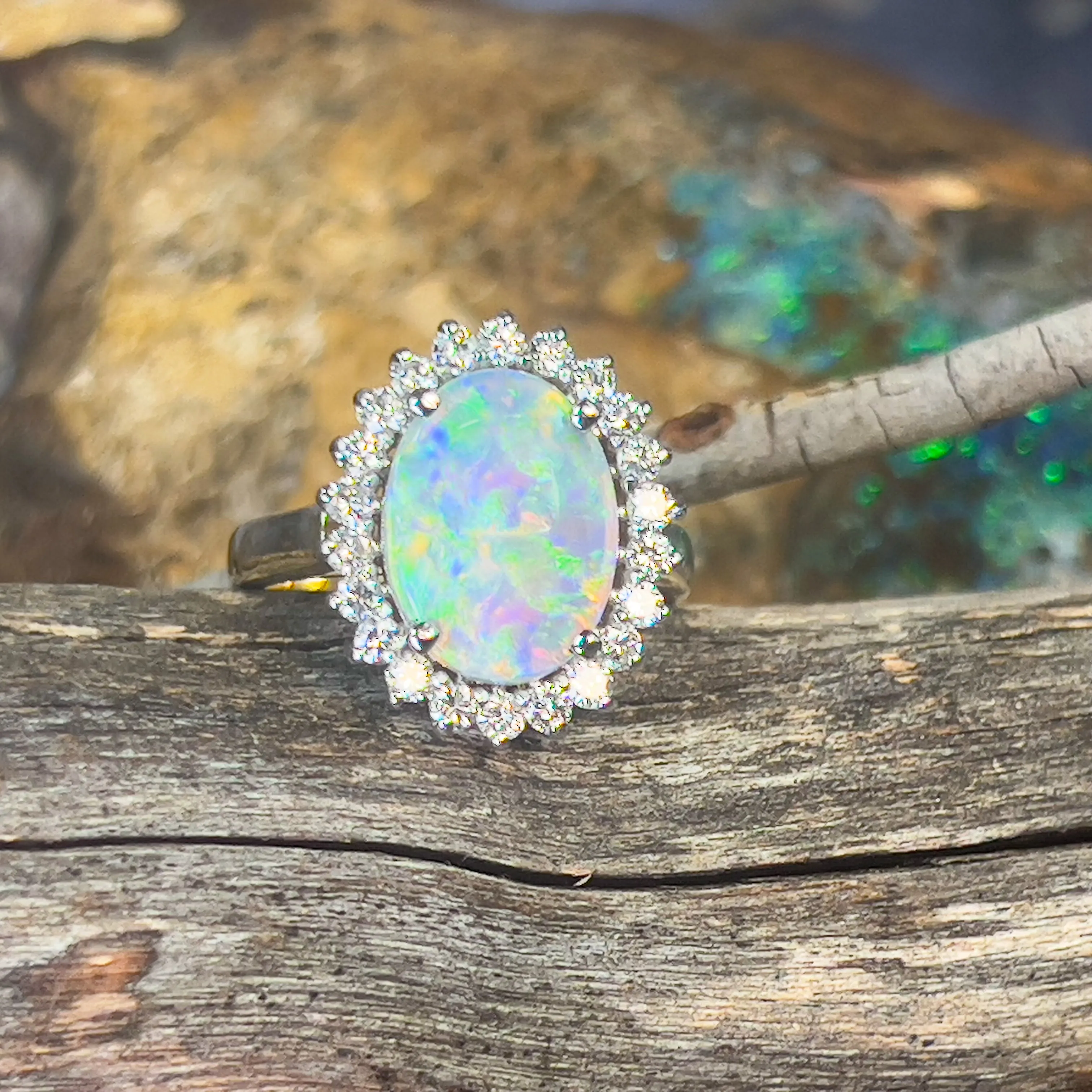 Platinum and 18kt Yellow Gold classic cluster ring with Black Opal and Diamonds