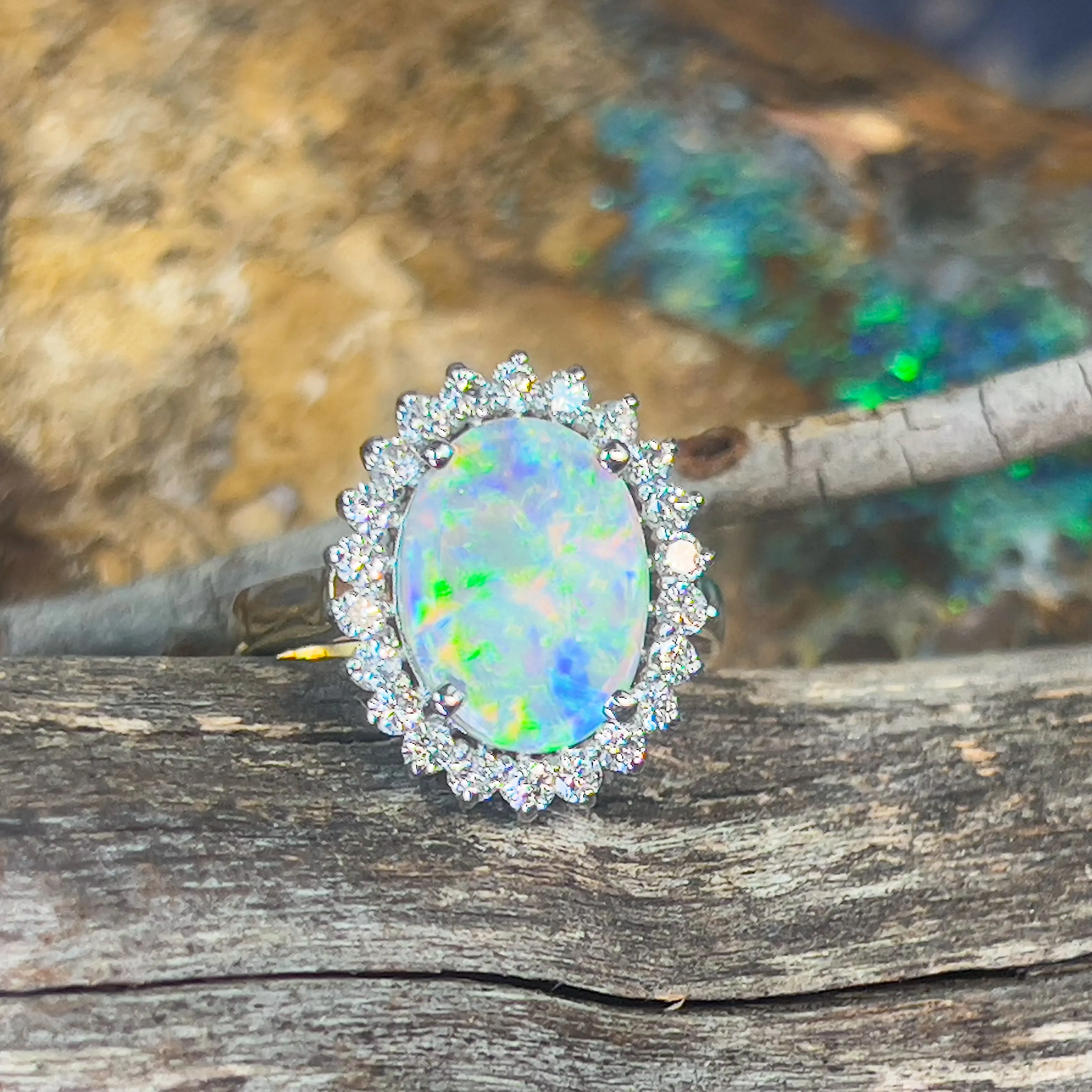 Platinum and 18kt Yellow Gold classic cluster ring with Black Opal and Diamonds