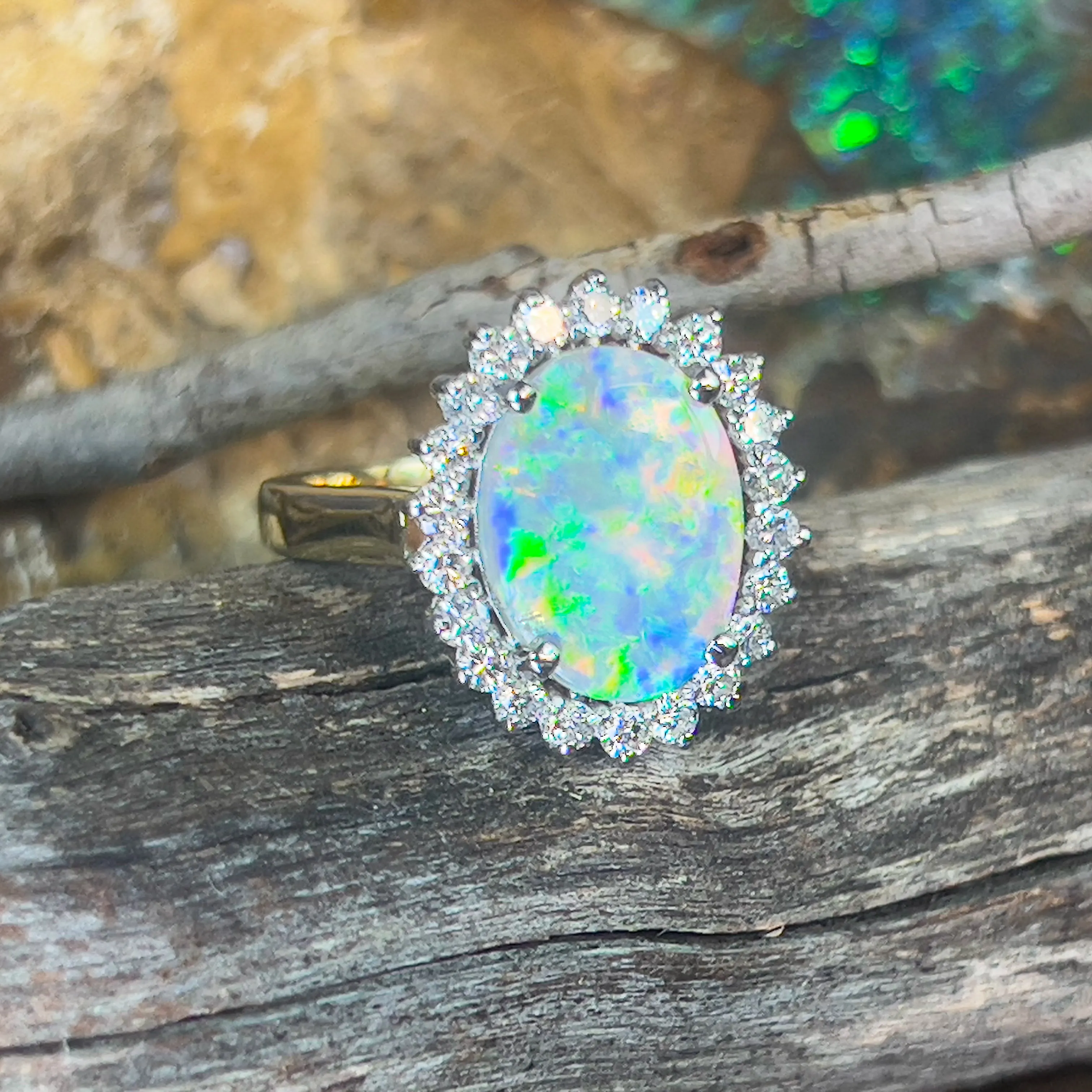 Platinum and 18kt Yellow Gold classic cluster ring with Black Opal and Diamonds