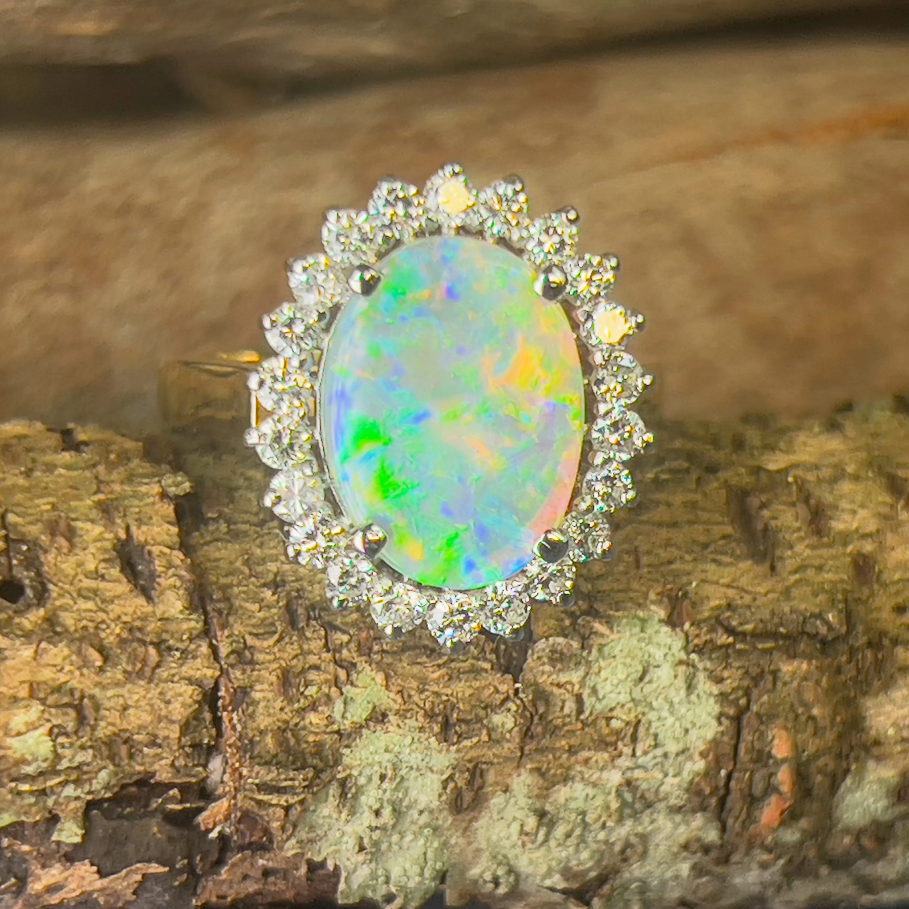 Platinum and 18kt Yellow Gold classic cluster ring with Black Opal and Diamonds