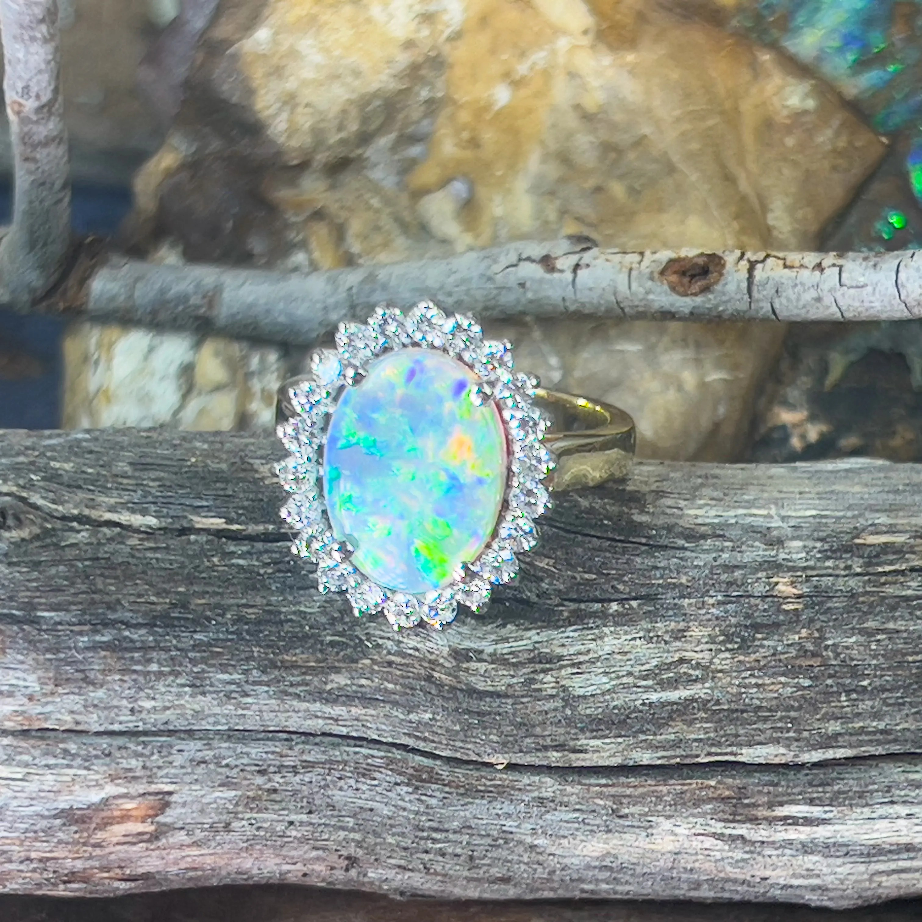 Platinum and 18kt Yellow Gold classic cluster ring with Black Opal and Diamonds