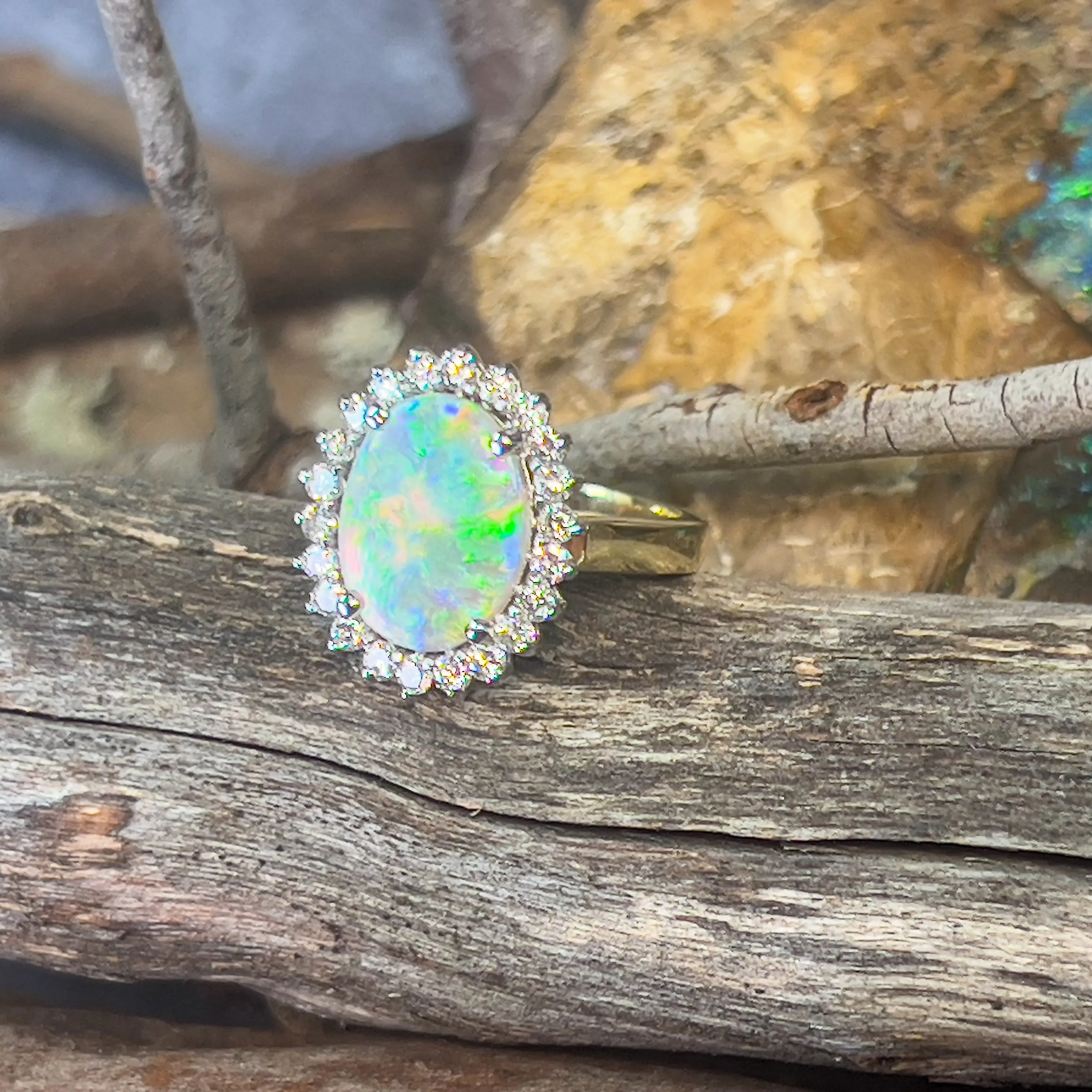 Platinum and 18kt Yellow Gold classic cluster ring with Black Opal and Diamonds