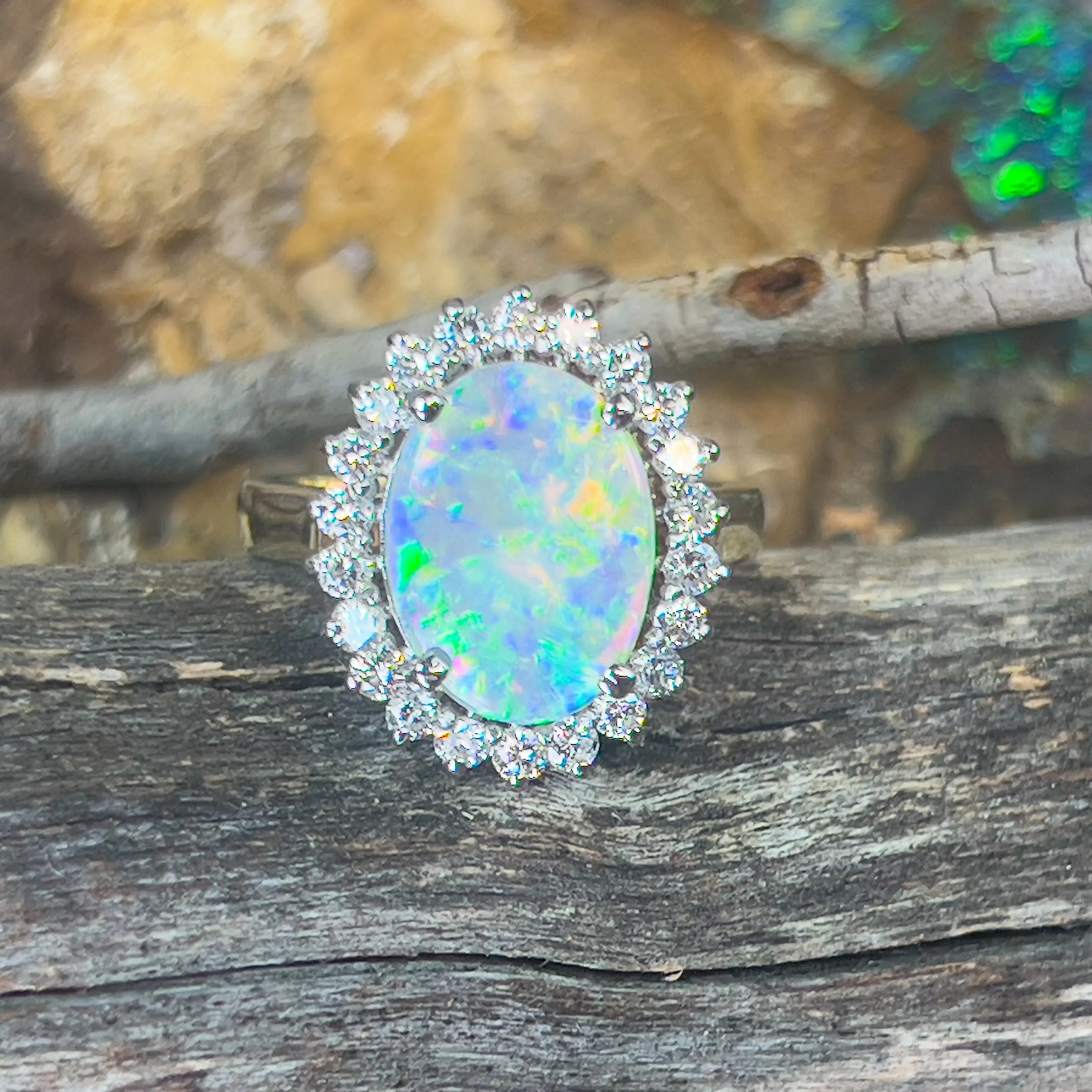 Platinum and 18kt Yellow Gold classic cluster ring with Black Opal and Diamonds