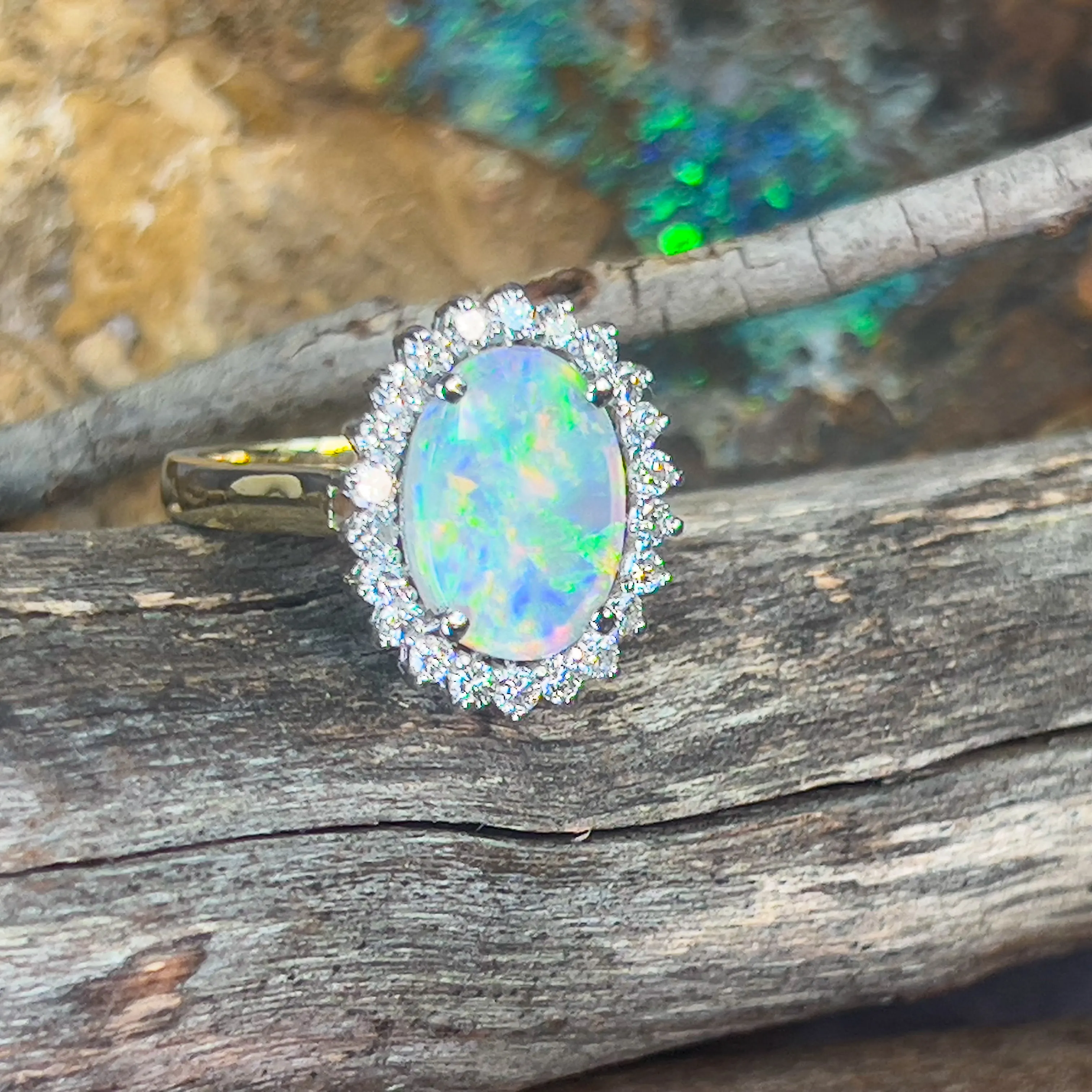 Platinum and 18kt Yellow Gold classic cluster ring with Black Opal and Diamonds