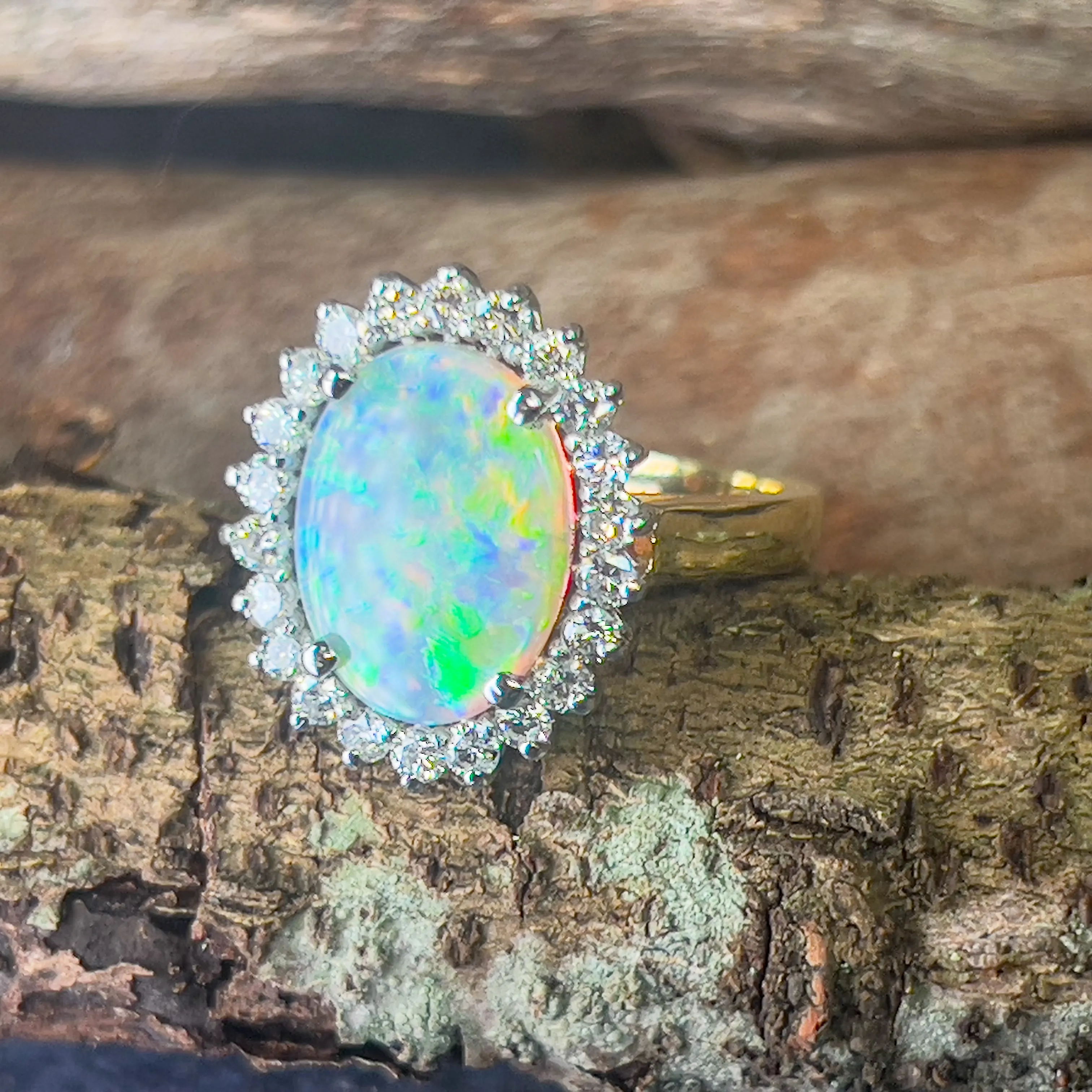 Platinum and 18kt Yellow Gold classic cluster ring with Black Opal and Diamonds